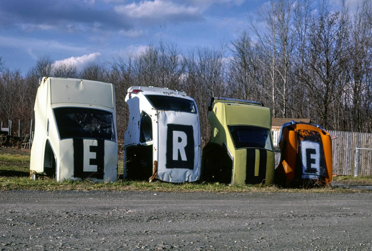 Historic Photo : 1987 Erie Foreign Car Parts multi-statue sign, angle 1, Mohawk Street, Whitesboro, New York | Margolies | Roadside America Collection | Vintage Wall Art :