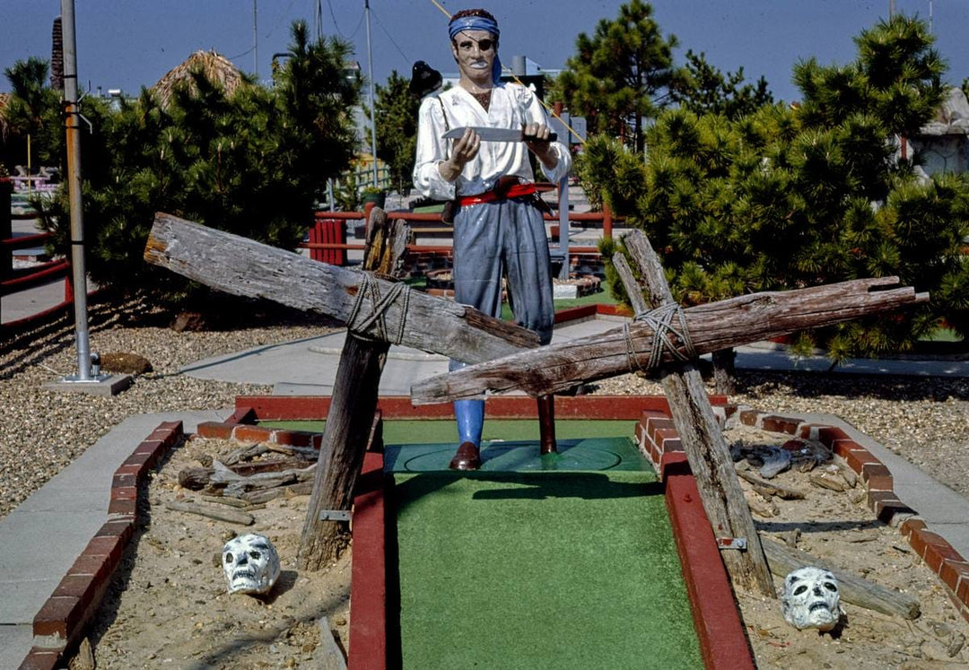 Historic Photo : 1985 Old Pro Golf, pirate course. Pirate with knife and skull, Ocean City, Maryland | Margolies | Roadside America Collection | Vintage Wall Art :