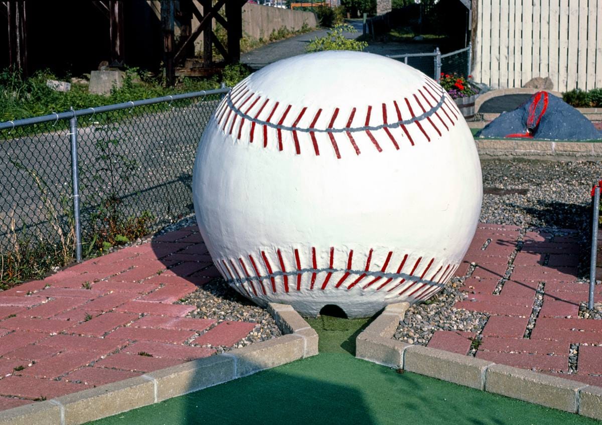 Historic Photo : 1984 Giant baseball hole, Salute to the USA mini golf, Lake Winnipesaukee Pier, Weirs Beach, New Hampshire | Photo by: John Margolies |