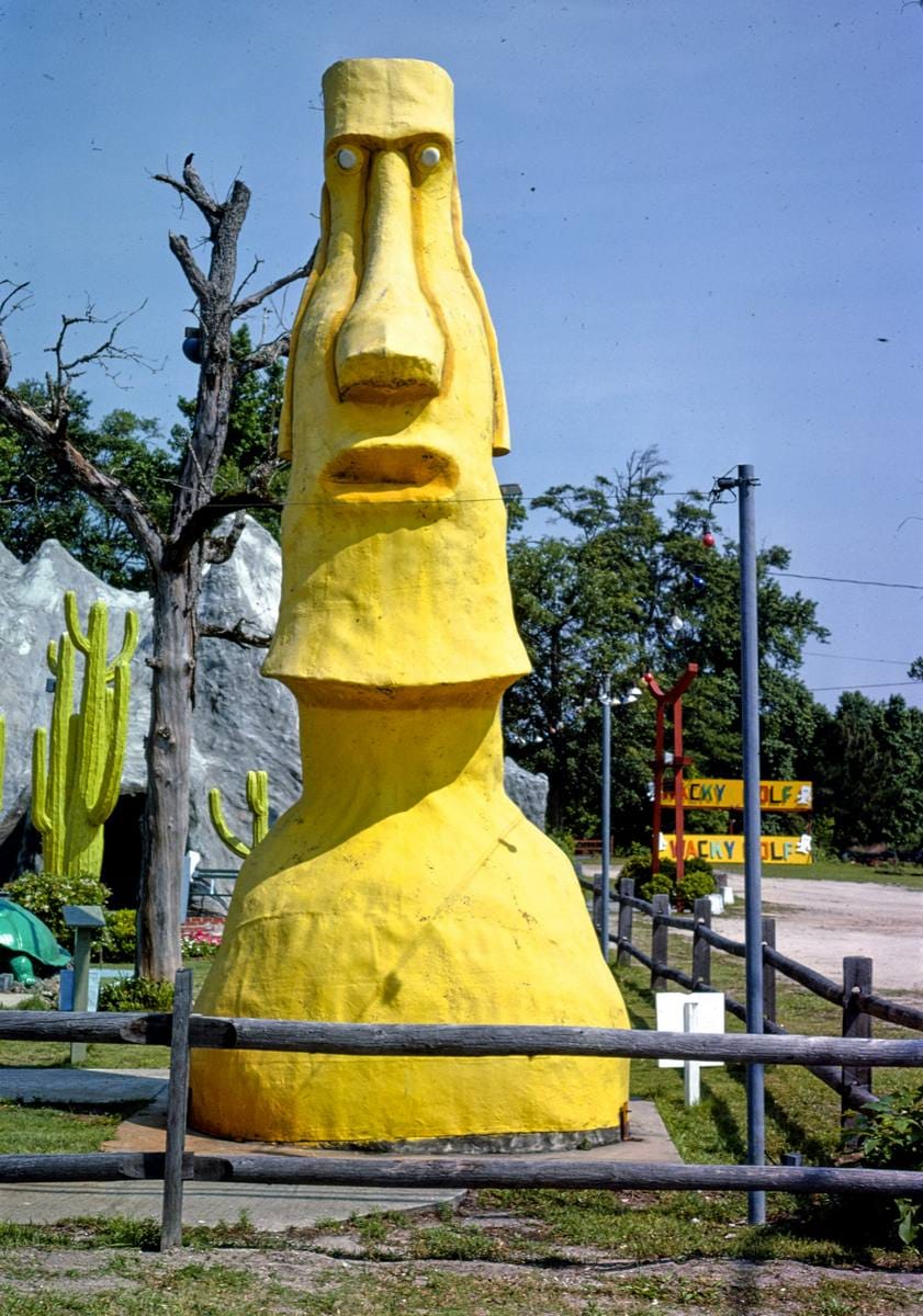 Historic Photo : 1979 Yellow Easter Island statue 3, Wacky Golf, North Myrtle Beach, South Carolina | Margolies | Roadside America Collection | Vintage Wall Art :