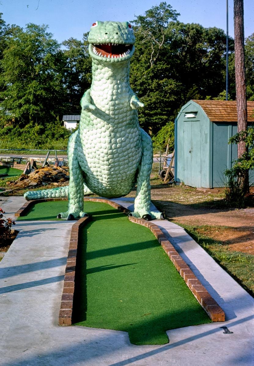 Historic Photo : 1979 Green dinosaur hole, Wacky Golf, Myrtle Beach, South Carolina | Margolies | Roadside America Collection | Vintage Wall Art :