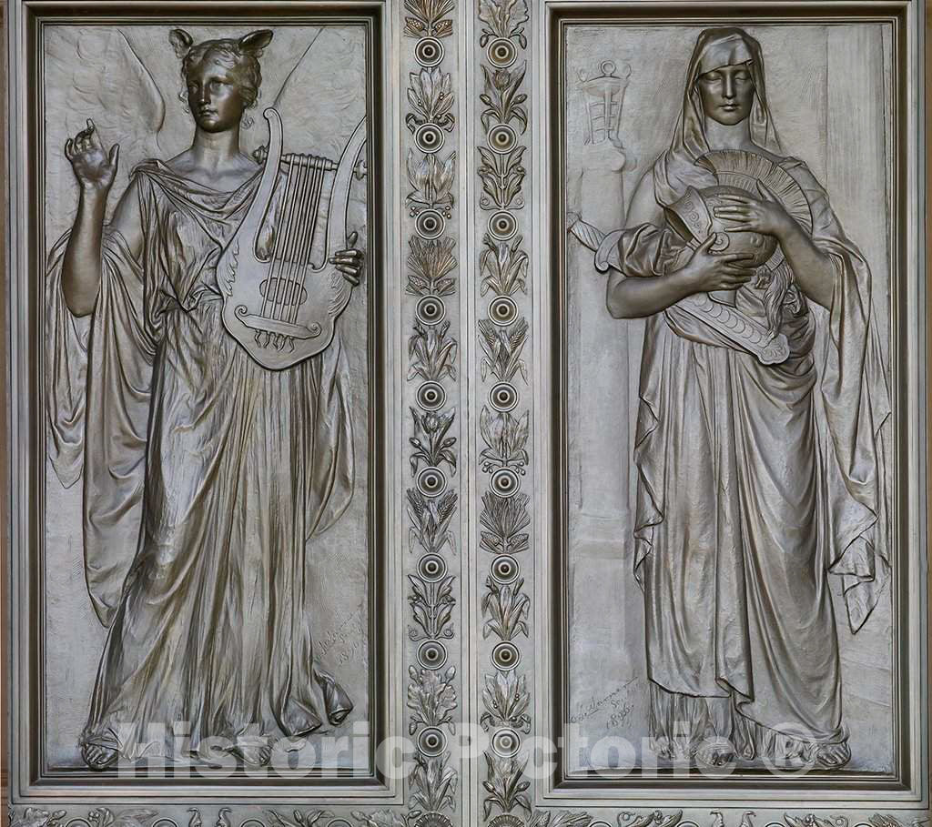 Photo- Exterior view. Bronze doors at the main entrance with female figures representing Imagination (woman holding a lyre) and Memory (woman holding a helmet), by Olin L. Warner