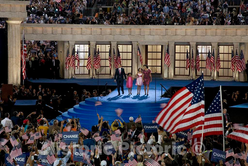 Photograph- Presidential candidate Barack Obama, his wife Michelle, and his children Malia and Sasha wave to the audience at the Democratic National Convention, Denver, Colorado, August 25-28