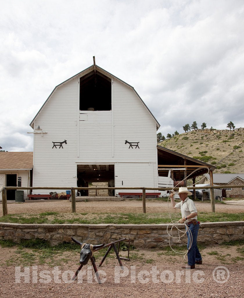 Wyoming Photo - A Guest practices lassoing at Eaton's Dude Ranch, Wyoming