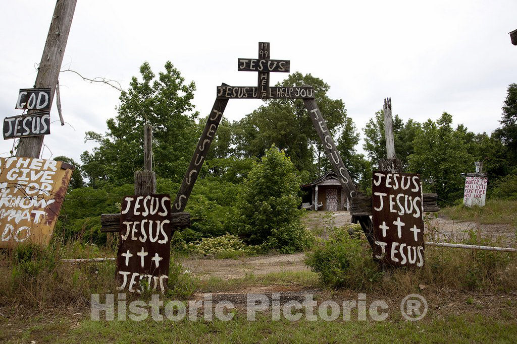 Prattville, AL Photo - Rough Wooden Crosses and Peeling Hand-Lettered Signs Bearing Bible Scripture Fragments are Nailed to Fences, Trees, Prattville, AL