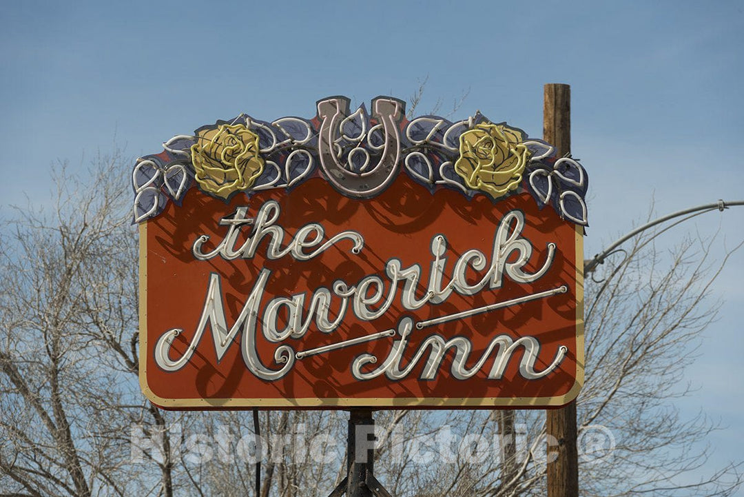 Alpine, TX Photo - Daytime View of a neon Sign for The Maverick Inn-