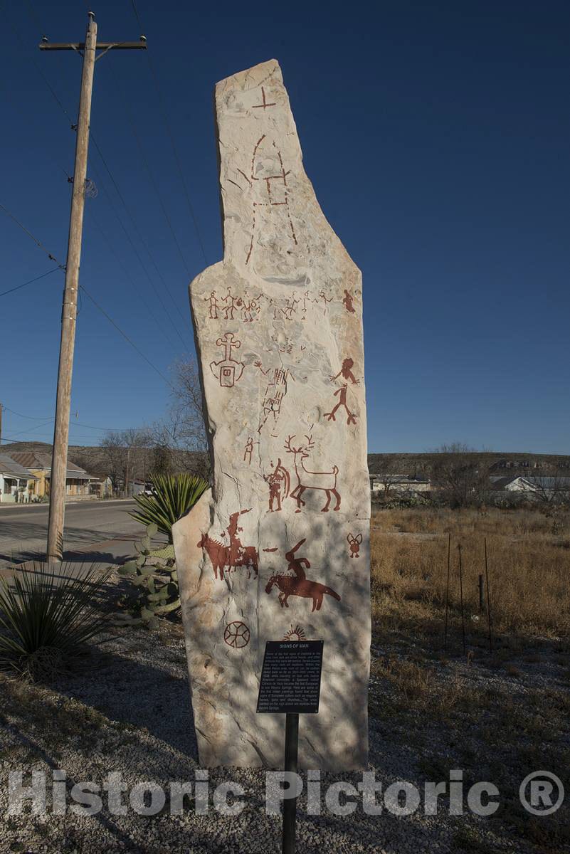 Photograph- An artistic rock carving that highlights the many pictographs by native peoples found among the rocks in surrounding Terrell County, in the"Trans-Pecos" region of southwest Texas