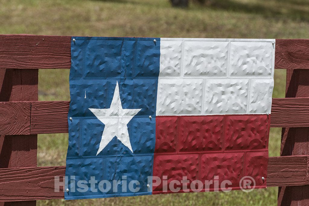 Washington County, TX Photo - A metal version of the Texas Lone Star state flag, fashioned on a section of ceiling tin, on a ranch fence in Washington County, Texas