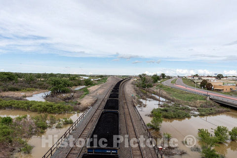 Photo - What seems like an endless coal train passes beneath a bridge overlooking the expansive trainyard in La Junta, Colorado- Fine Art Photo Reporduction