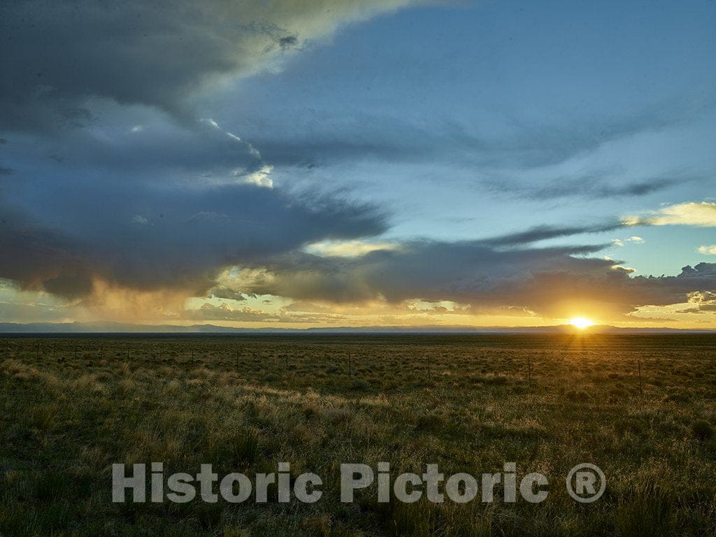 Alamosa County, CO Photo - Sunset over the mountains near the Great Sand Dunes National Park and Preserve in Alamosa County, Colorado.