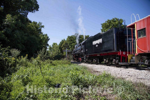 Photo- The First Few Cars of a Vintage Train of The Boone & Scenic Valley Railroad, a Heritage Railroad That operates Excursions in Boone County, Iowa, Chug Through The Brush