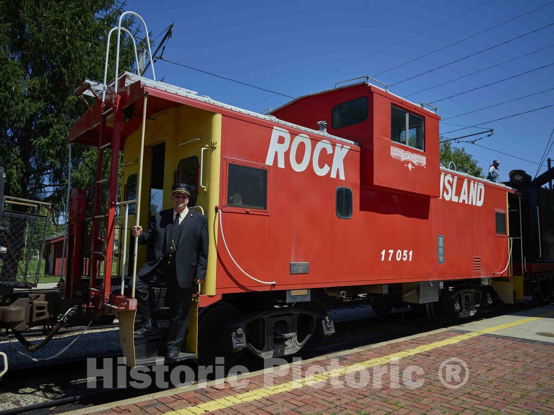 Photograph- Conductor Gary Jaehnel Looks Out from The Caboose of a steam Train Prior to Departure in The Yards of The Boone & Scenic Valley Railroad, a Heritage Railroad That operates excu