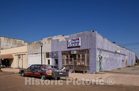 Photo- Vintage car from the days of oversized, gas-guzzling vehicles, decorated with a scrawled homage to the town's rich blues heritage, in Clarksdale 1 Fine Art Photo Reproduction