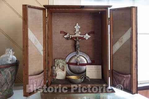 Photo- Cabinet containing artifacts at the Old St. Joseph's Catholic Church, now a museum informally called the Church of the Yellow Fever Martyrs, in Holly Springs, Mississippi